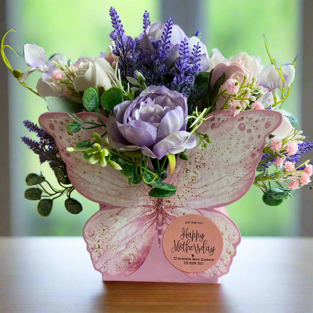 artificial silk flowers in butterfly container for mothersday