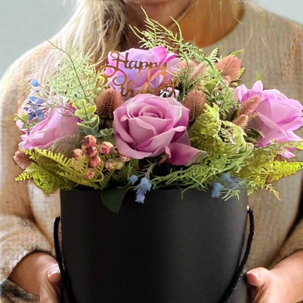 XL flower arrangement of large luxury roses and thistles in hat box