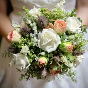 artificial pink and white wedding bouquet with thistles