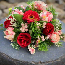 grave pot with flowers featuring artificial silk blooms