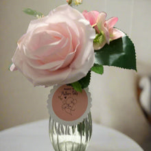 posy of mothersday pink rose and hydrangea in glass vase