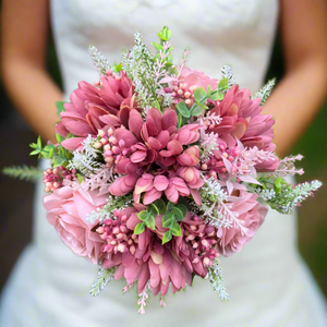 A brides posy featuring artificial pink silk gerbera and roses