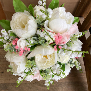 a brides bouquet of artificial silk ivory and pink peony & roses