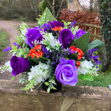 Artificial graveside flowers arrangement in black pot