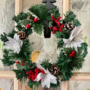 christmas wreath with pine and white poinsettia flowers