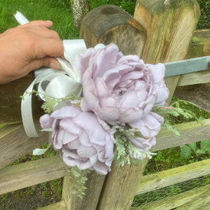 a wedding bouquet of artificial silk lilac peonies
