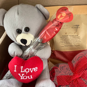 A grey teddy with heart, red soap roses bath dust and sexy red lace g string for your valentine