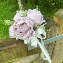 a wedding bouquet of artificial silk lilac peonies
