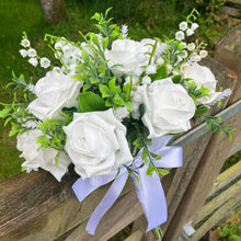 a wedding bouquet collection of white or ivory roses & lily of the valley