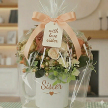Flower arrangement in mum mug