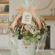 Flower arrangement in mum mug