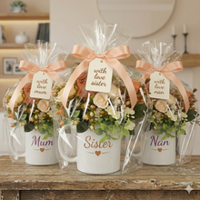 Flower arrangement in mum mug