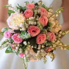 - An artificial wedding bouquet of artificial pink roses, peony & lily of the valley