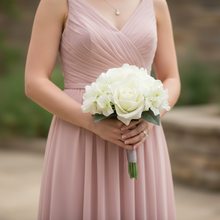 A wedding bouquet collection of artificial silk ivory flowers