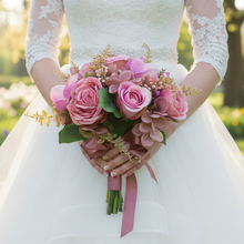 A wedding bouquet colllection of dusky pink roses, hydrangea and orchids