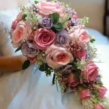 A wedding bouquet collection of artificial faux silk pink & lilac roses & crystals