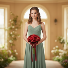 A bridesmaid bouquet or red artificial silk roses and hydrangea