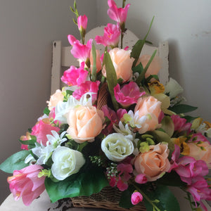 A large bespoke front facing artificial flower arrangement