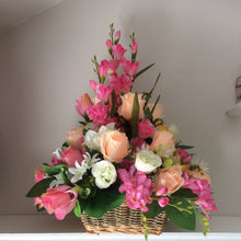 A large bespoke front facing artificial flower arrangement