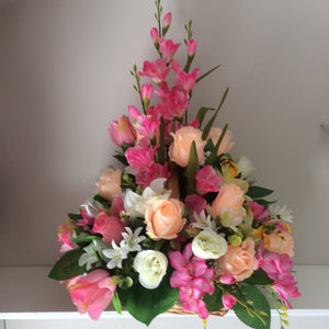 A large bespoke front facing artificial flower arrangement