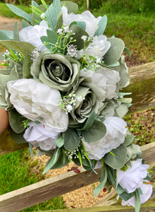 A teardrop wedding bouquet collection of artificial sage green and white roses