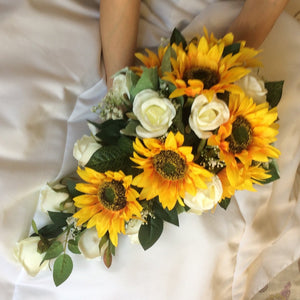 A teardrop bouquet collection of artificial ivory roses and sunflowers