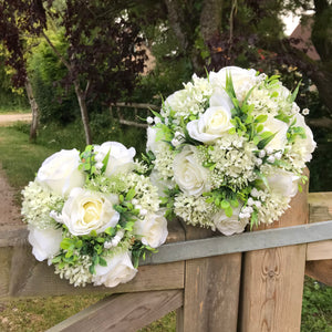 A wedding bouquet collection of ivory artificial silk roses