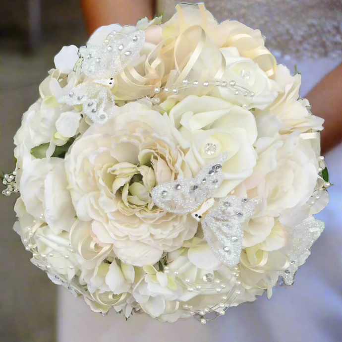 artificial wedding bouquet featuring champagne and ivory flowers