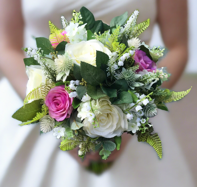 A wedding bouquet featuring ivory & Violet silk roses