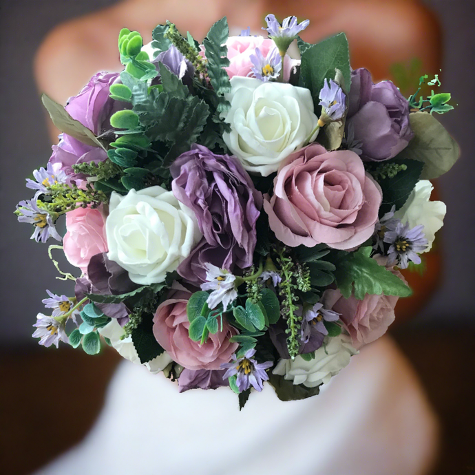 A bridal bouquet of lilac and pink flowers