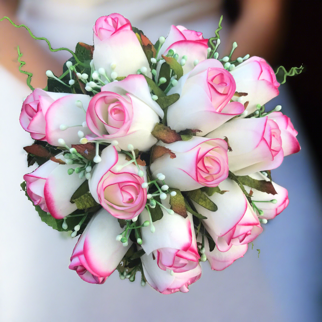 A bridal bouquet of artificial pink edged roses