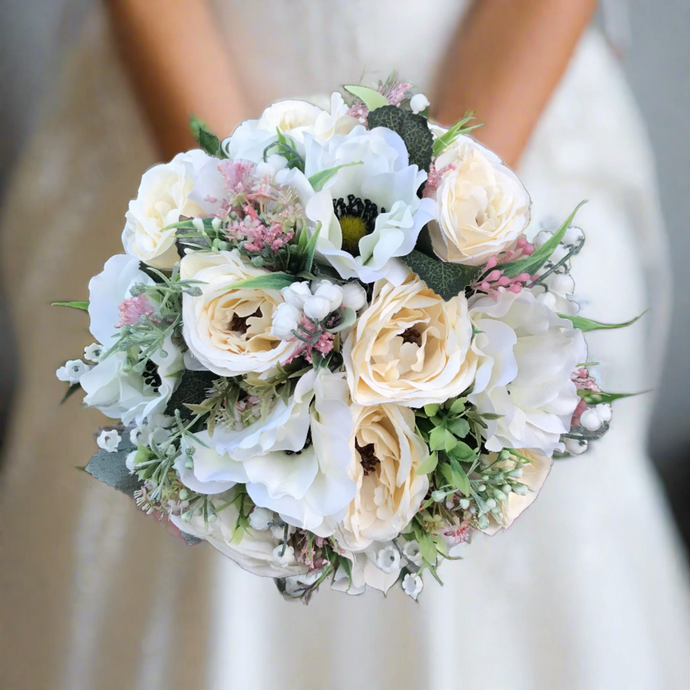 wedding bouquet of artificial ivory and cram flowers