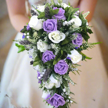 A teardrop bouquet collection of ivory and lilac artificial roses