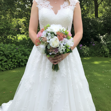 A wedding bouquet of artificial ivory and pink Flowers