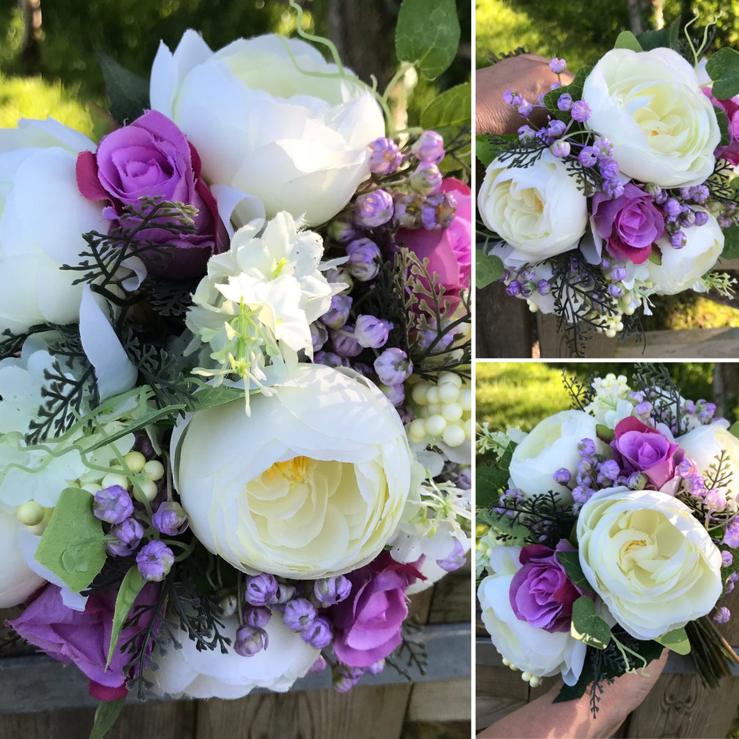 A brides bouquet of pink and lilac artificial silk flowers