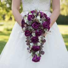 A collection of wedding bouquets featuring  artificial purple rose flowers & thistles