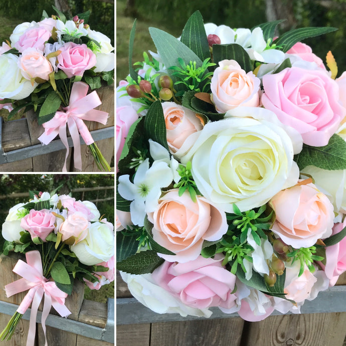 a wedding bouquet of artificial ivory peach & pink rose flowers