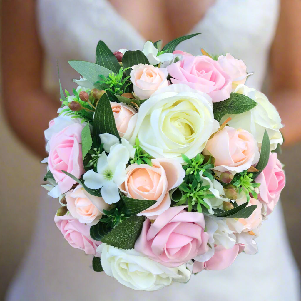 wedding bouquet for the bride in shades of pink and peach