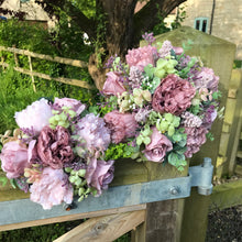 a wedding bouquet collection of pink and mauve flowers