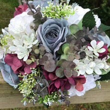 Wedding bouquet in shades of lilac grey burgundy and pink