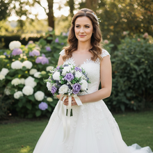 a wedding bouquet of artificial ivory & lilac roses diamante & pearls