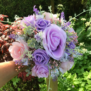 A wedding bouquet collection of pink & lilac roses