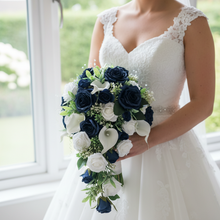 A teardrop bouquet collection of artificial roses, gyp and calla lily