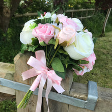 a wedding bouquet of artificial ivory peach & pink rose flowers