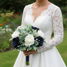 A teardrop bouquet collection of artificial roses, gyp and calla lily
