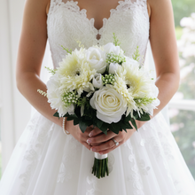 A bridal bouquet collection of ivory and white silk flowers