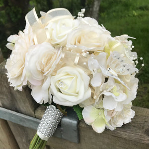 - artificial wedding bouquet featuring champagne and ivory flowers
