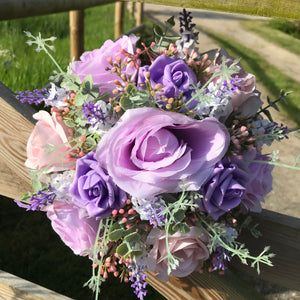 A wedding bouquet collection of pink & lilac roses