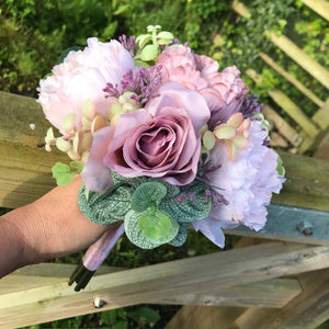 a wedding bouquet collection of pink and mauve flowers