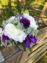 a wedding bouquet of ivory & purple artificial rose Flowers